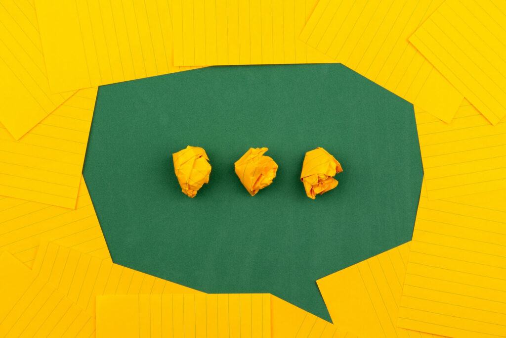 Yellow paper organised in the shape of a chat bubble