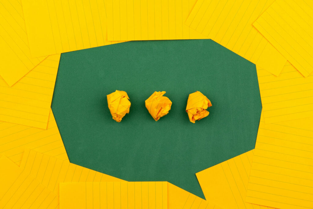 Yellow paper organised in the shape of a chat bubble